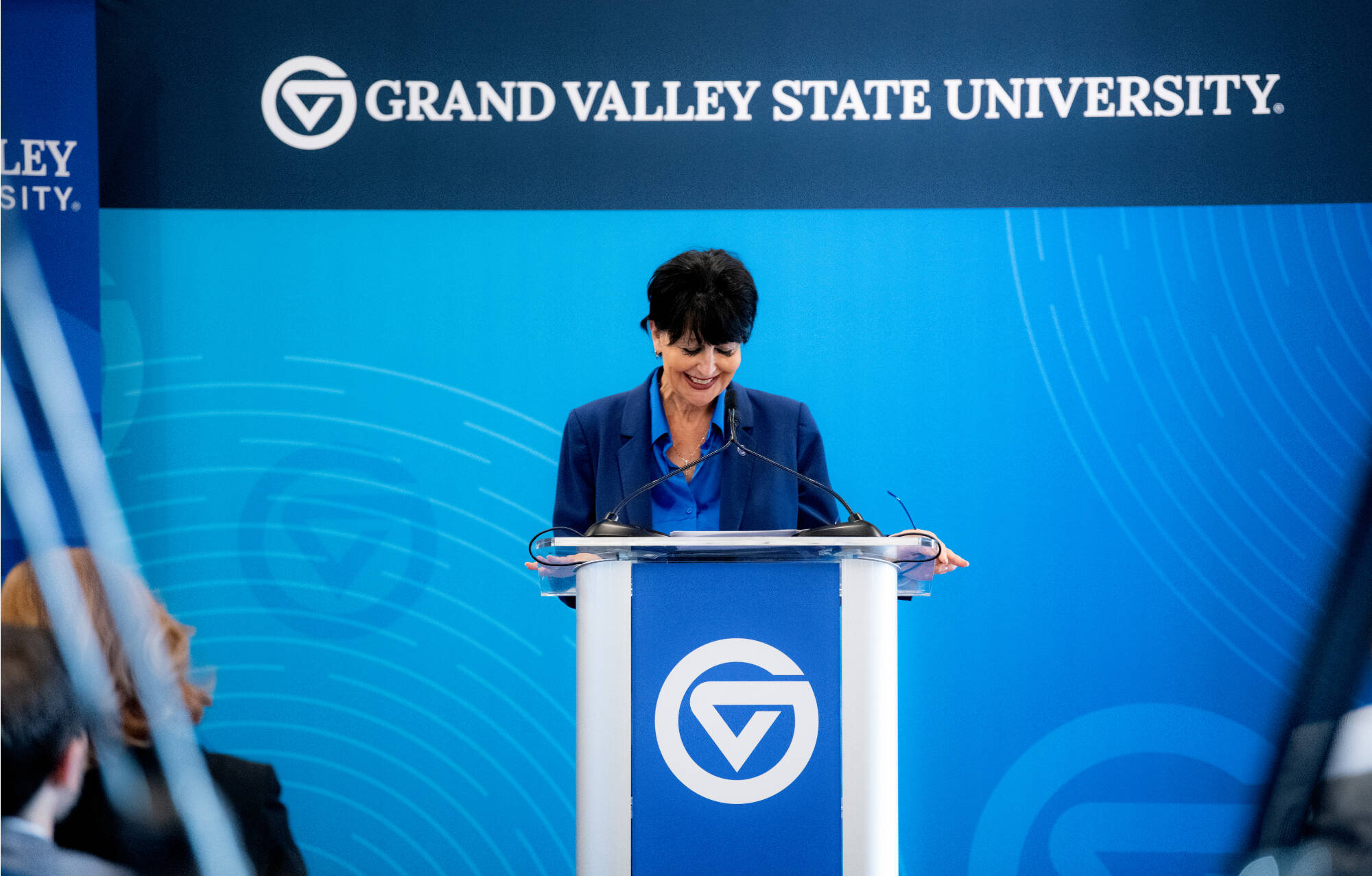 President Philomena V. Mantella smiles during an applause as she spoke at a press conference to share GVSU’s economic impact report. The press conference was held in the Seidman Forum Room inside the L. William Seidman Center on the City Campus Octob...